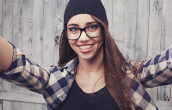 cheerful teenager with glasses and braces