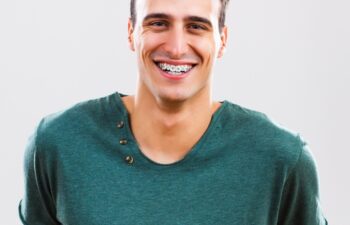 Portrait of content young man with braces.